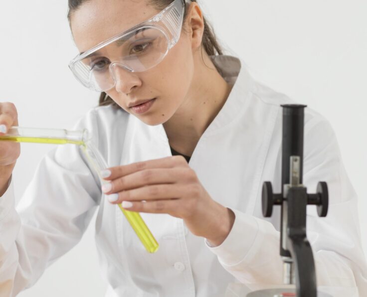 front-view-female-scientist-analyzing-potions-tubes