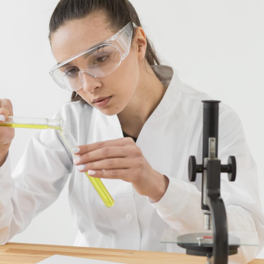 front-view-female-scientist-analyzing-potions-tubes