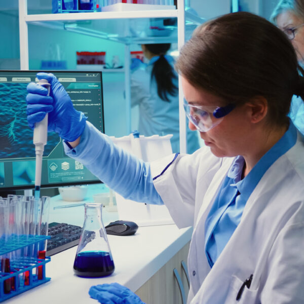 Chemist putting liquid in test tube with micropipette in modern equipped laboratory. Multiethnic team examining vaccine evolution using high tech and chemistry tools for virus development research SSUCv3H4sIAAAAAAAACoxWy47bOBC8B9h/GPC8RPgWlS/IJaccF3ugSNomIomGRCW7CObft/U06VVmcrGt7mKxWd0q+ucfH15eUGPGYNGnl5/zEzyHtp3GNJgUYg9h8ucWH3zv/JBHvg9ckTzgXUhxCKbNg41J9tabzkOwn9p2Dr8uSTQmk6bRj9nuXbBDHFO03+5QBiTozuMGb7oxhYWIVQd9uK7wW0wRMnxP2NjGaWjiPzlJB9wLsqA2LjZ+YSmorekL6kdmvE0p+eH/S5y/xzE8tnhk7rF3soh0cZbYt77zfRrz0injw6VcPRO6qZ/PzjMFrUn+CpIXGu4d/Wt9ftkT26ESpNBXG3xvPdo2WE81NXPqSxitb1vT+wgd2PPrhr9g++xNm27WDP7jFxgCCxPw+8Trj7+PZlyhsH/n47xmBx1AJ7OOynYsRBVVgkiOrTA1FuqicK3sBWtvifGc10zyvQwkL6JRVDhs5UViIRuNjYYPbxzhyta1leIAO04qQ3yFiXcXLBrGsNaMY1ZZ57W0RDF1gBnRRlGjMKVMYSFUhTWpBCYNd9RqSU39ANPqooTTHlPnoQzCGyhDQc2W0FoAt1FuUWaVA337AWPWLc3dhDCTCzFr9vcIai/Tk6l1H4IN/TVbFtNteXn3ZTZOfRpmmdFRXBvj3TTtPGMX4PR7/GbGEeBuj+fzB1YRu2yfPqalSRsrcjCg8yPlTEqmOdO1BMXgC+UecAvAs5SzFzjd22icnzc9Bu7EHRSpK0moEMe8lUYxAzTnSu0v14llnGEK9zjJl0ZyAig85XSHJ3c5wzz5zBnk2XHOMLv3nB/kyYU2UKUz0G5Ia04QVq2p3RTmN7wLUGrZrty1lqWiEoK/2amZ+00RBRXyvVaWmHOhS8y5iiWmVLHMPQnElH6niYJr/U4TaqYpoZvQxa0JRMHljl8ICY6kxNxBcrzZhY4IbIcAQMoj/ywjQKjmVZXZnH1SEWktuRB15ppPGiLBa80I5+yA7BIiKhRhQulHCbuCcBZzjaMFJByKgQKEEPib8YurF1GtKyK1UpuhnKkJVwUBlxdssdZNxjDPKmLCGd40NYZaCdwLjuG6IgSrysN1IWrthIVVr/8BAAD//wMA2IFpXSwJAAA=